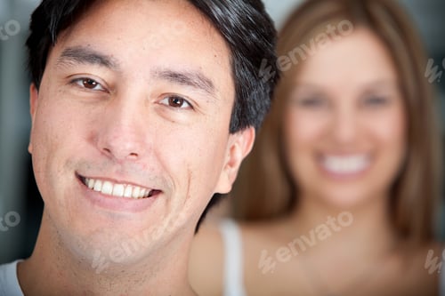 Preview: Handsome Man Smiling With A Woman Behind Him