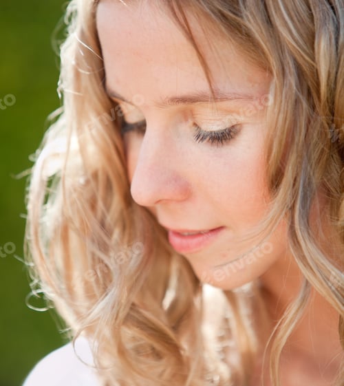 Preview: Beautiful Blond Woman Portrait With A Green Background
