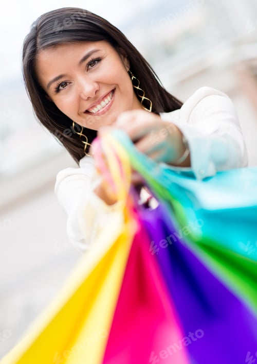 Preview: Happy Female Shopper Holding Shopping Bags