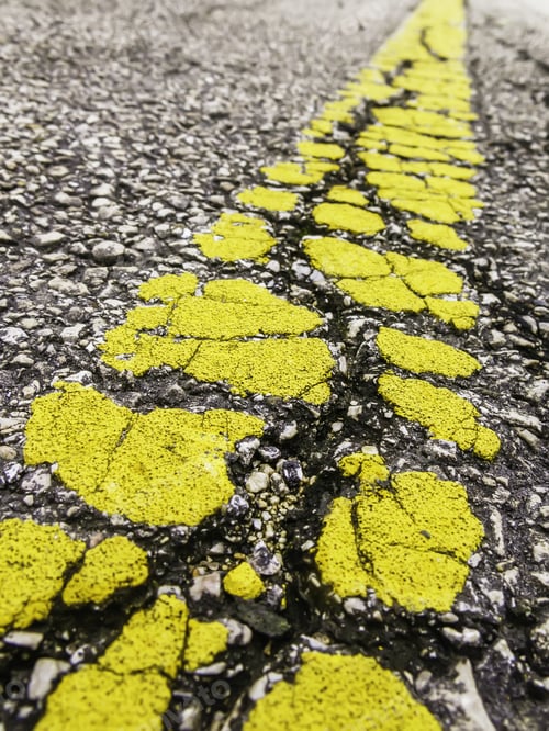 Preview: Fragmentation And Time: Breakup Of Yellow Center Line On Old Asphalt Road (Shallow Depth Of Field)