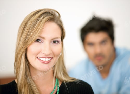 Preview: Casual Woman Smiling With Her Friend Behind Her