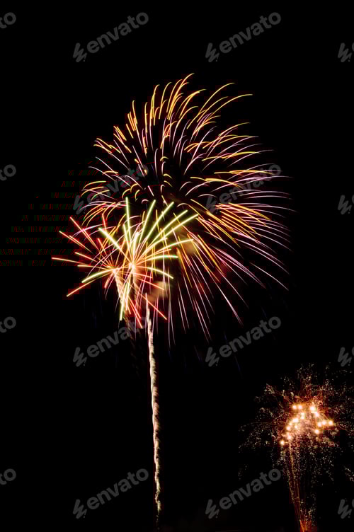 Preview: Multicolored Bursts Of Fireworks With White Rocket Trail Above Small Cloud Of White-Hot