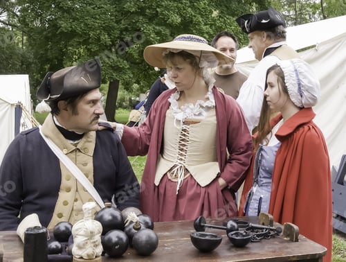 Preview: Wheaton, Illinois/Usa - September 13, 2014: A Woman And Girl In Period Dress Speak With A Fellow