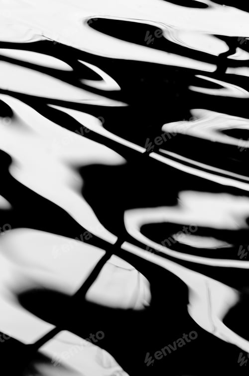 Preview: Magical Sky: Abstract Shapes On Reflective Surface Of Shallow Garden Pond, In Black And White, For
