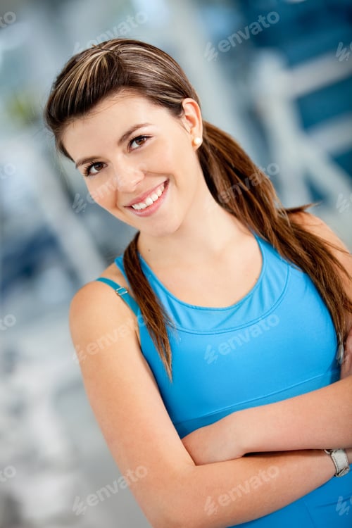 Vista previa: Beautiful Athletic Woman At The Gym Smiling