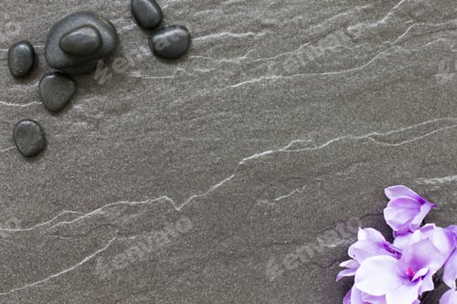 Preview: Spa Treatment Stones And Orchid On A Tiled Floor Conveying Tranquility