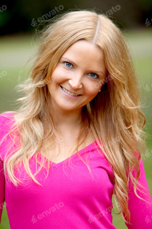 Preview: Portrait Of A Beautiful Woman Smiling Outdoors