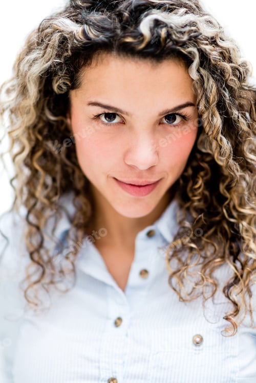 Preview: Portrait Of A Serious Woman With Curly Hair