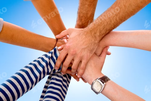 Preview: People Teamwork With Hands Together Over A Blue Background