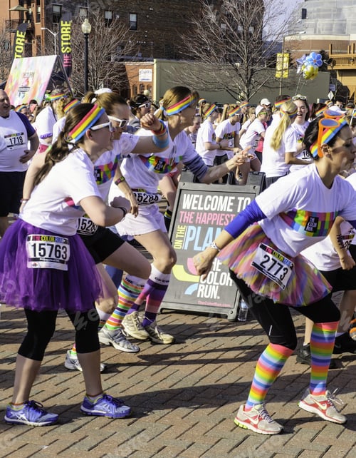 Preview: Kalamazoo, Michigan, Usa - April 12, 2014: Participants In Colorful Attire Dance Together To Warm