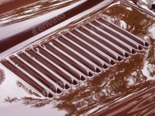 Preview: Detail Of Hood On Shiny Red Classic Car