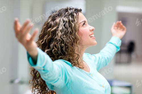 Preview: Successful Business Woman At The Office With Arms Open