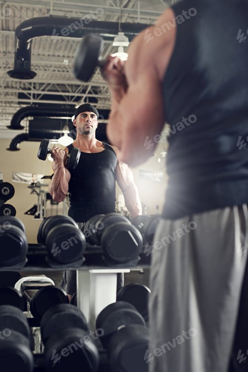 Preview: Bodybuilder Working Out With Bumbbells Weights At The Gym