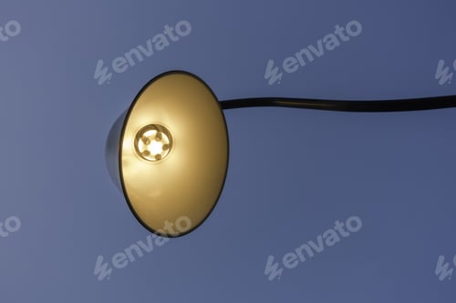 Preview: Electric Light Fixture Extending Outward From The Shop Or Restaurant It Illuminates (Off Camera)