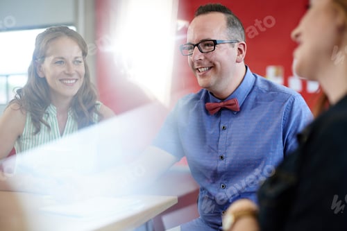 Preview: Unposed Group Of Creative Business People In An Open Concept Office Brainstorming Their Next