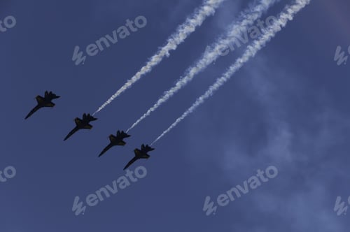 Preview: Janesville, Wi - May 31, 2009: Four F-18 Hornets Fly In Formation, Three Trailing Smoke, During A