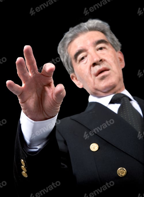 Preview: Business Man Solving A Puzzle Over A Black Background