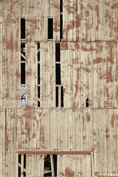 Preview: Side Of Faded Old Barn Missing Boards, With Remnants Of Red Paint