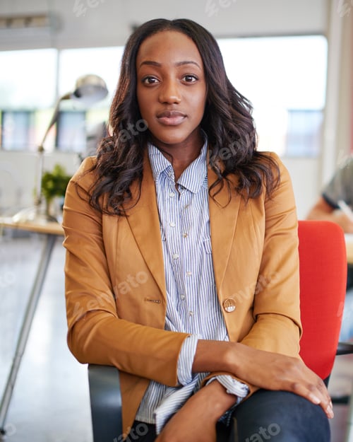 Preview: Confident Female Designer Working On A Digital Tablet In Red Creative Office Space