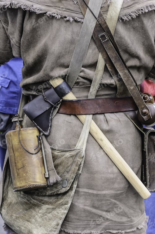 Preview: Wheaton, Illinois/Usa - September 12, 2015: A Tomahawk Hangs By A Flask On The Back Of A Militiaman