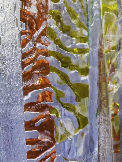 Preview: Abstract In Translucent Ice With Partial Backgrounds Of Red And Green Outdoors