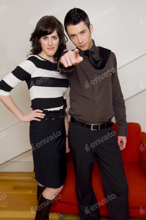 Preview: Couple Standing With Guy Pointing.