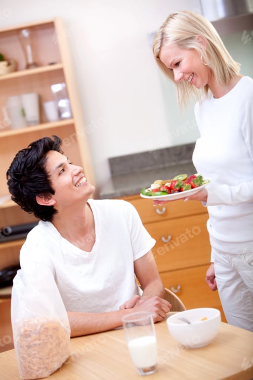 Preview: Woman Serving Breakfast To Her Boyfriend At Home