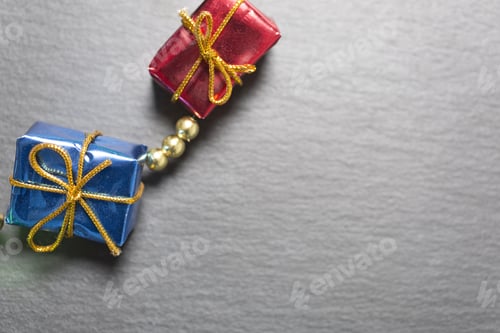 Preview: Small Christmas Gifts Decorations On A Dark Slate Surface
