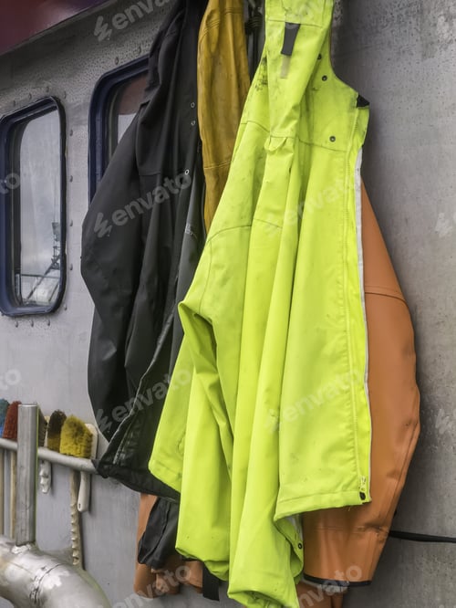 Preview: Heavy Weather Ahead: Rain Gear Hanging Together Aboard A Commercial Fishing Boat
