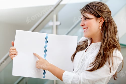 Preview: Business Woman Pointing At Something On A Notebook