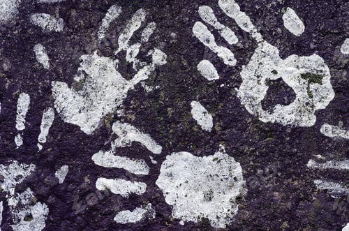 Preview: College Grunge: Impressions Of White-Painted Hands On Purplish Rock On University Campus