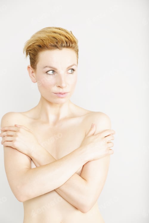 Preview: Blonde Woman Posing with Arms Crossed