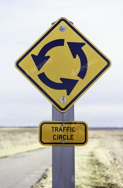Preview: Traffic Circle Sign Posted By Pavement (Shallow Depth Of Field)