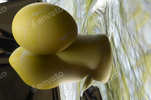 Preview: Yellow Easter Egg And Distorted Reflections