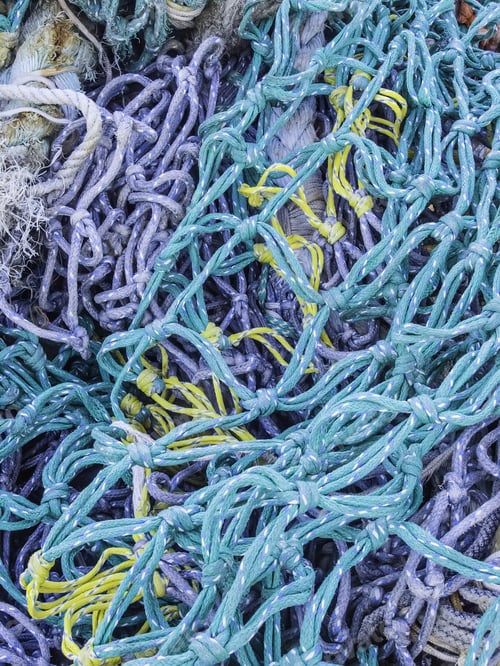 Preview: Commercial Fishing Nets Of Several Colors In A Storage Pile Outdoors