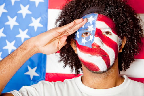 Preview: Patriotic American Man With The Usa Flag Painted On His Face Saluting