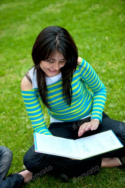 Preview: Casual Woman With A Notebook Studying Outdoors