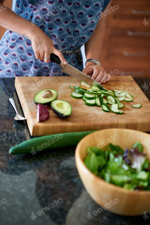 Preview: Mature Woman Chopping Vegetables