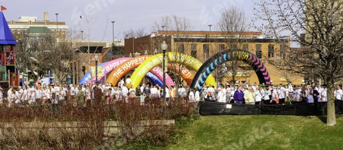 Preview: Kalamazoo, Michigan, Usa - April 12, 2014: Participants And Spectators Walk Together Toward The