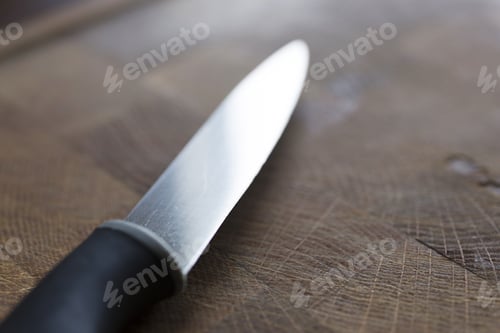 Preview: Knife Detail On A Wooden Chopping Board