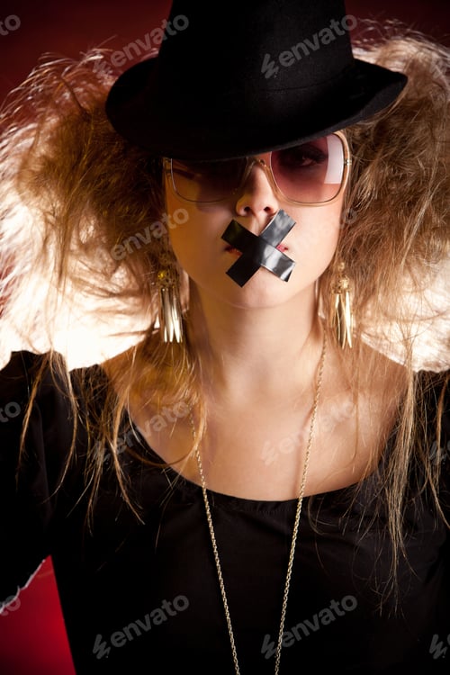 Preview: Silenced Eccentric Woman With Tape Over Her Mouth