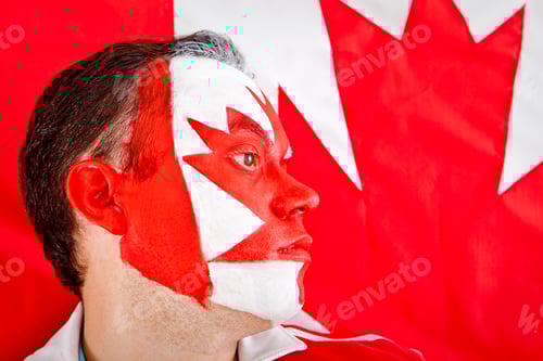 Preview: Patriotic Canadian Man With The Flag Painted On His Face