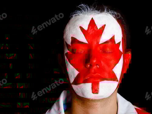 Preview: Canadian Man With The Flag Painted On His Face ? Isolated Over Black