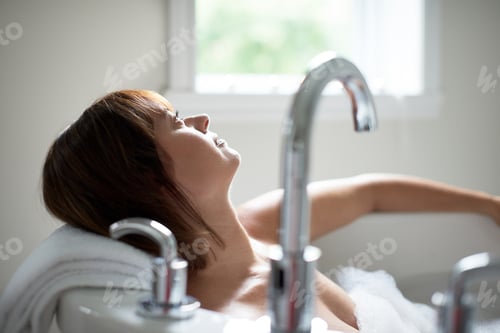 Preview: Pretty Mature Woman Looking Away In A Bathtub