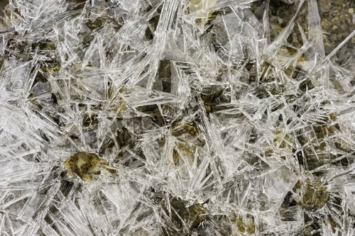 Preview: Advent Of Winter: Closeup Of Thin Ice Above Rocks At Edge Of Stream Late In Autumn (Shallow Depth