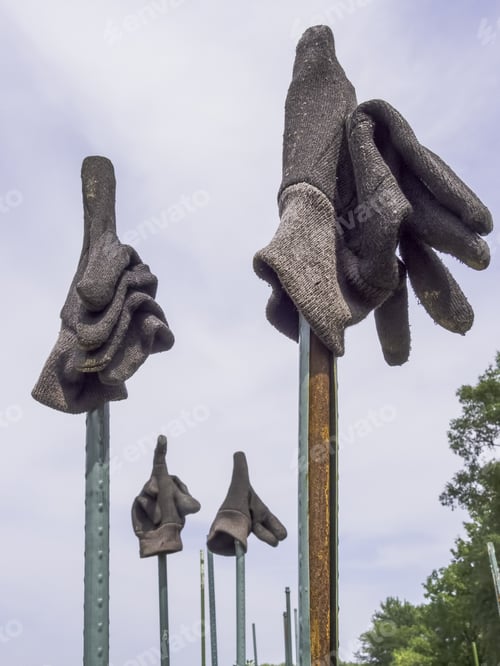 Preview: Two Pairs Of Gray Gloves On Posts In Community Garden, Northern Illinois (Foreground Focus)