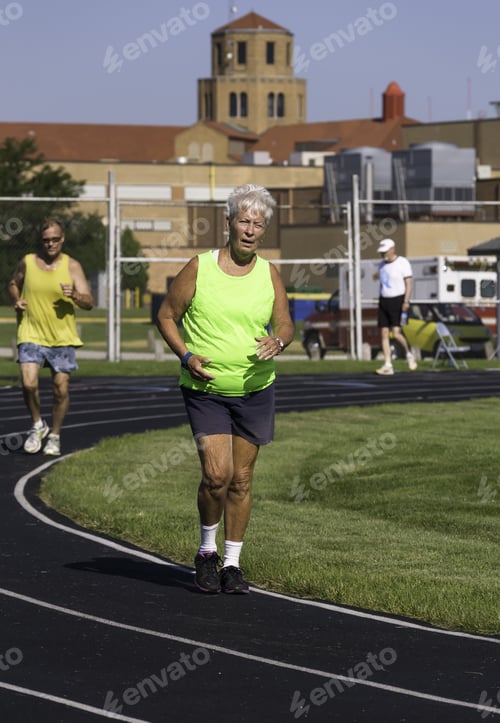Preview: Park Ridge, Illinois, Usa - July 23, 2015: Two Seniors, A Woman And A Man, Run A Mile-Long Race In