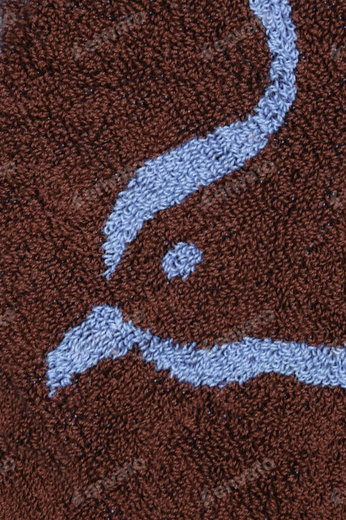 Preview: Detail Of Red Towel With Blue Head And Beak Of Bird