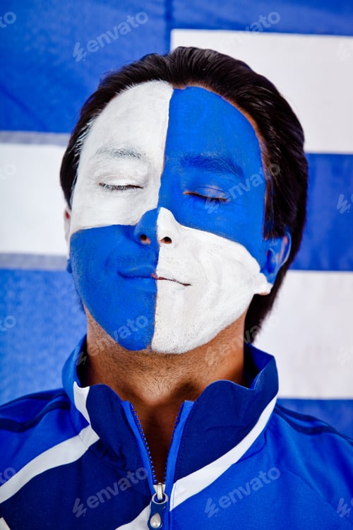 Preview: Man With A Blue And White Flag Painted On His Face