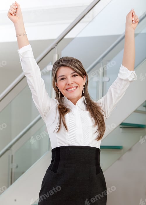 Preview: Happy Business Woman With Arms Up T The Office